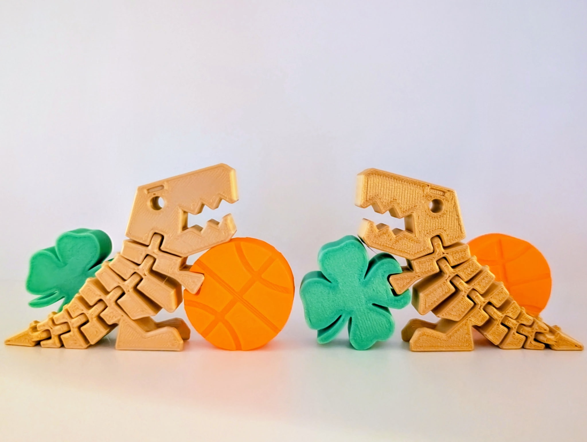 Gold Flexi-Rex holding Orange Basketball and Green Shamrock